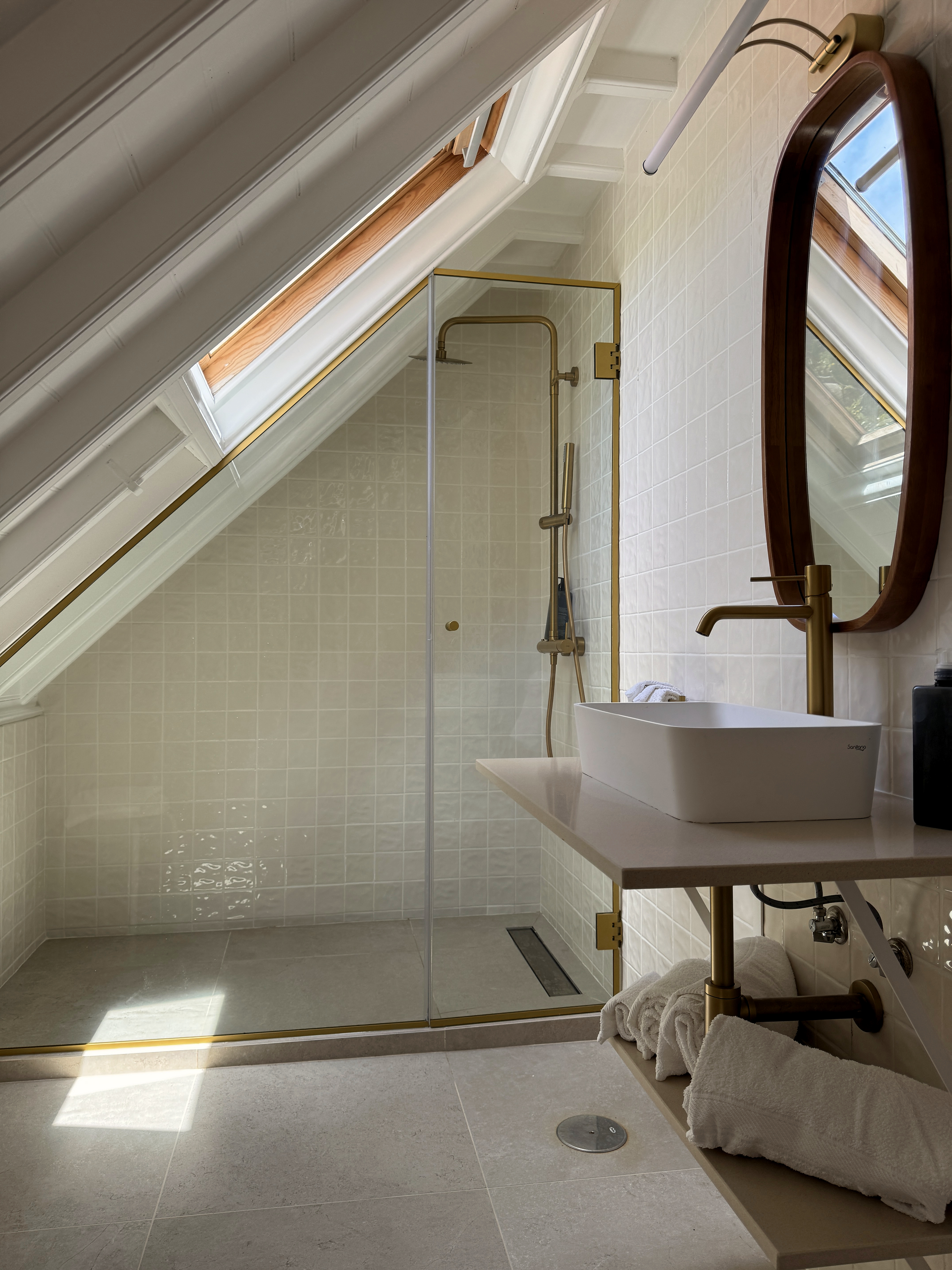 Walk-in shower in the upper-floor bathroom