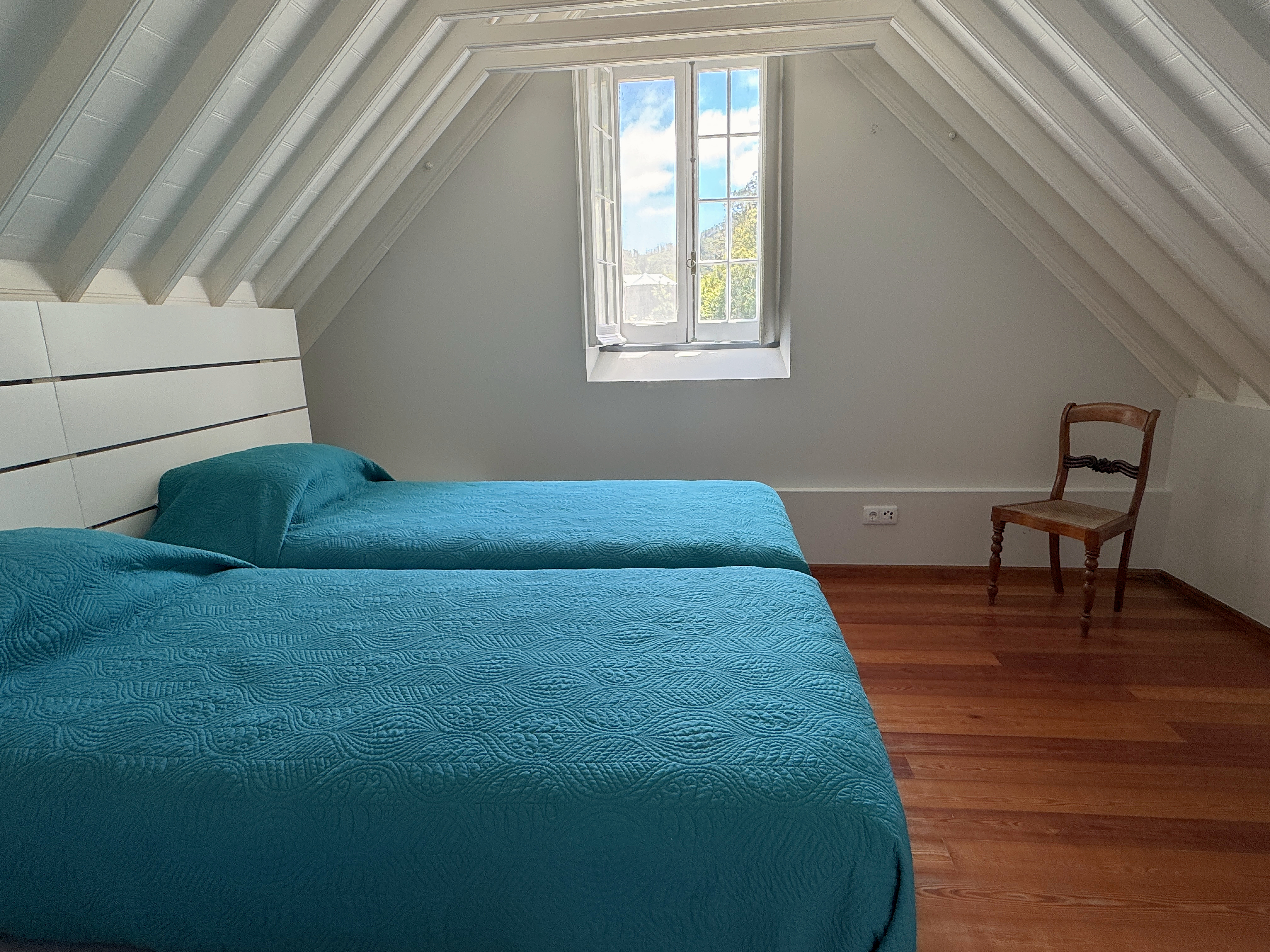 Twin bedroom beneath the pitched roof